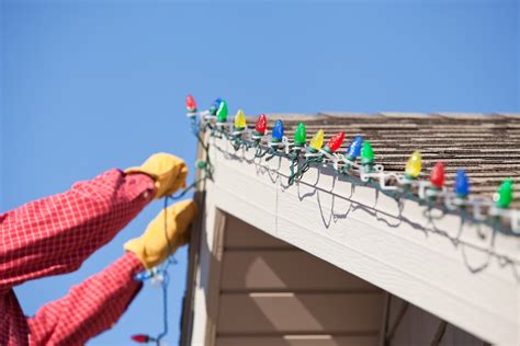 installing christmas lights on house